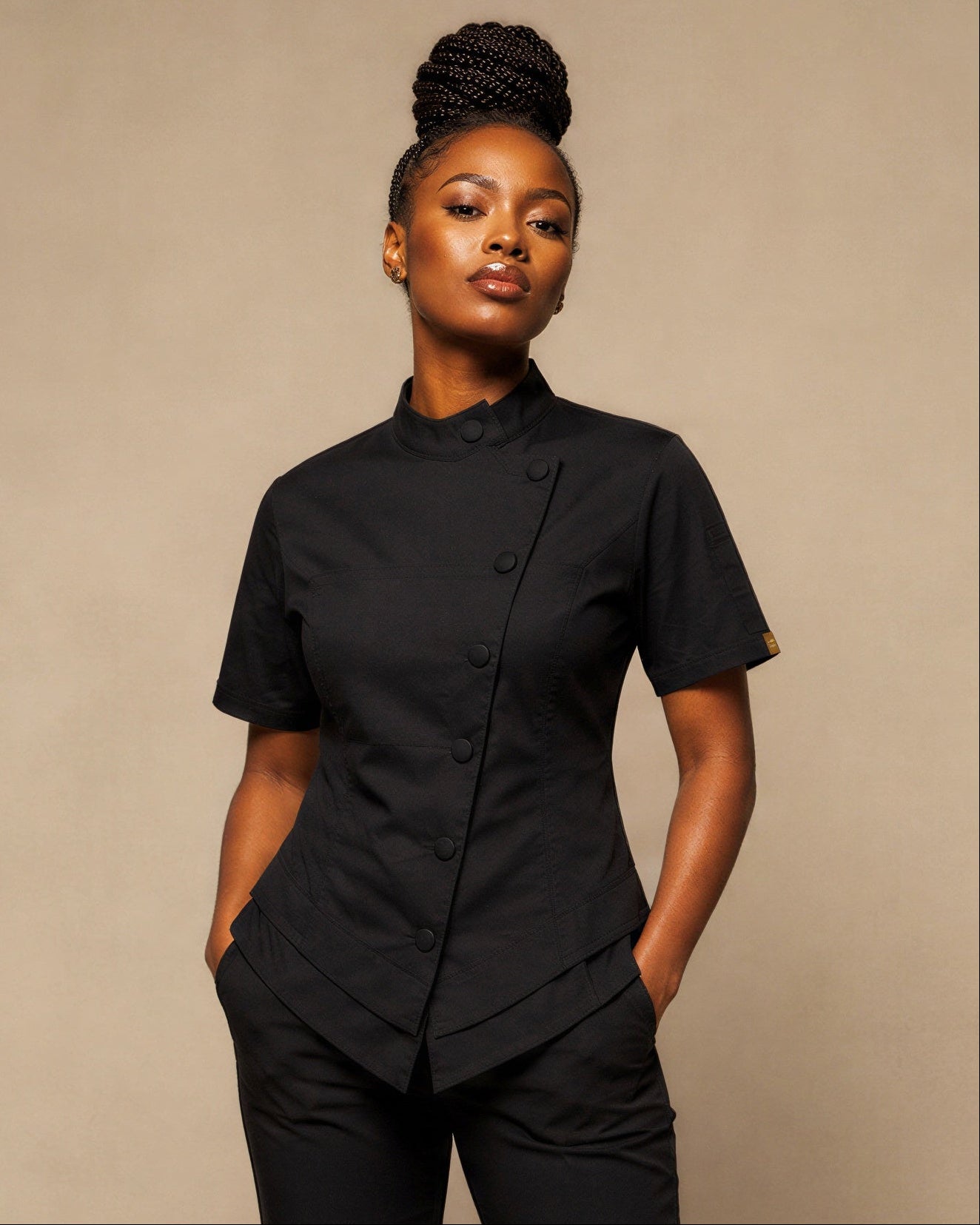 Saisha wearing The Modern Culinarian Signature Black Currant women's chef coat in medium.